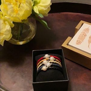 5 colorful brackets with center pearls.